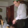Mike carves up some meat, Christmas in Devon and Stuston - 25th December 1991