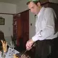 Mike carves up some meat, Christmas in Devon and Stuston - 25th December 1991