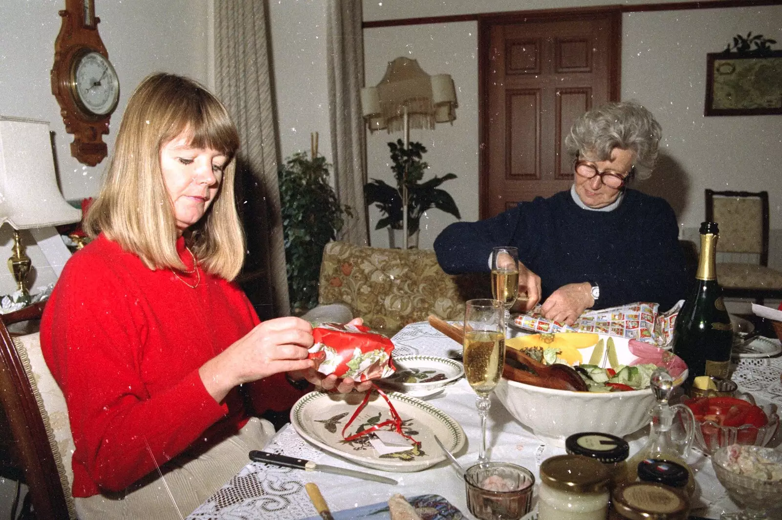 Mother inspects a present, from Christmas in Devon and Stuston - 25th December 1991