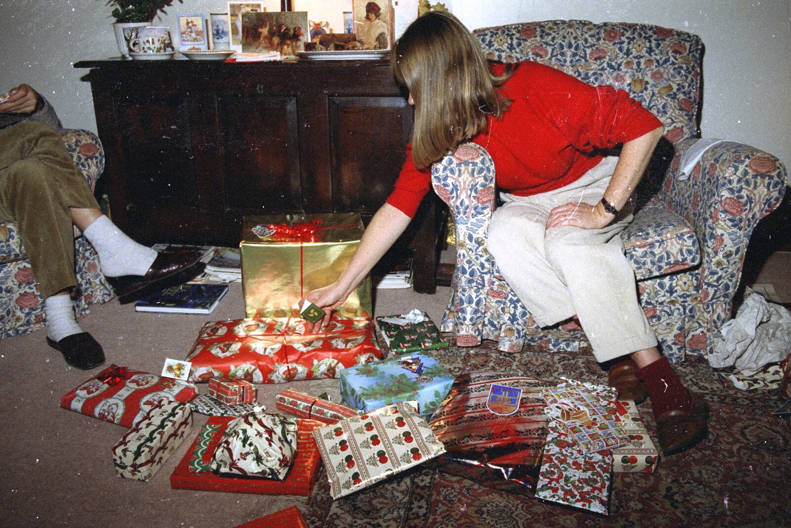 Mother is surrounded by a pile of presents from Christmas in Devon and Stuston - 25th December 1991