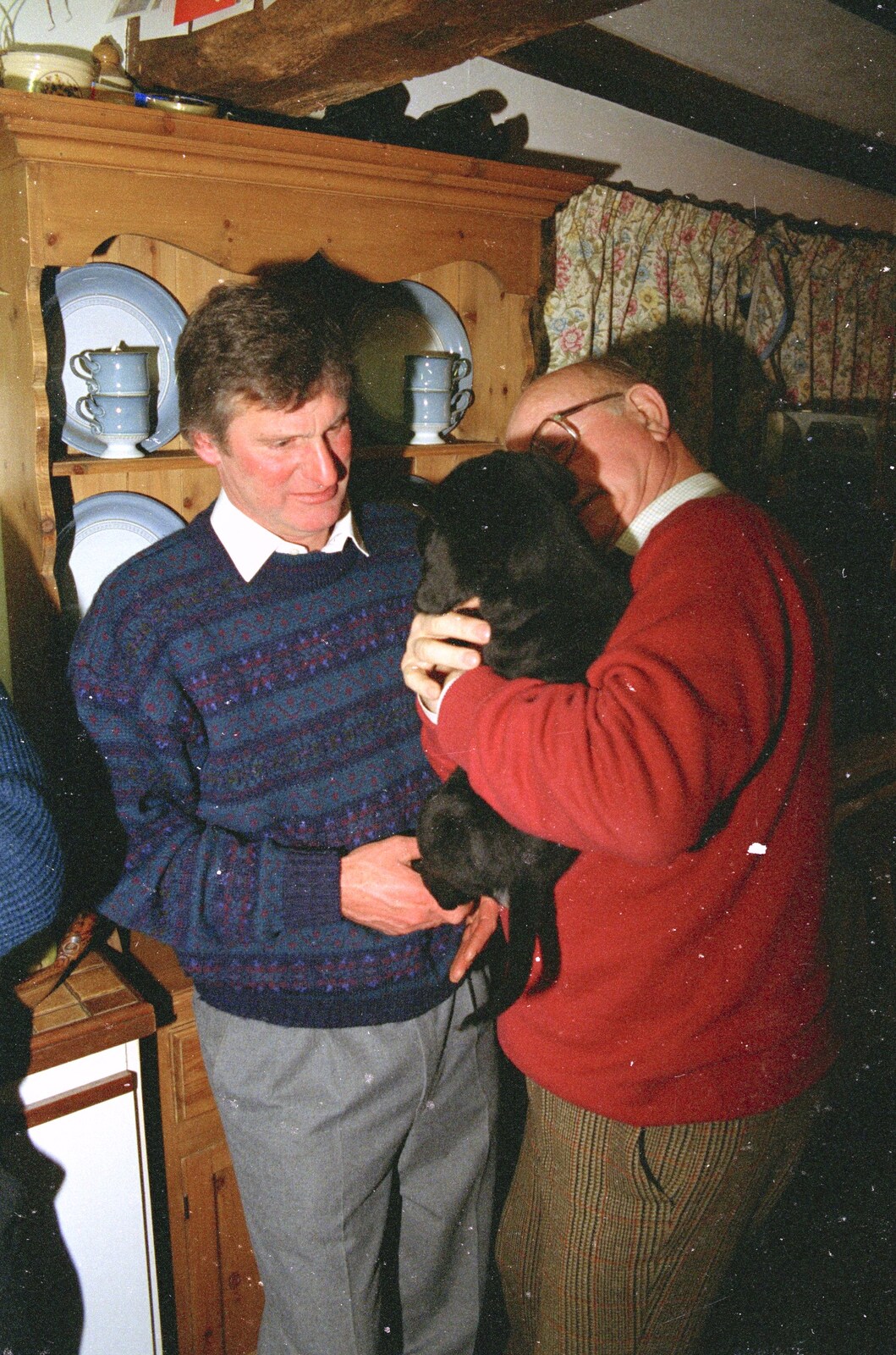Geoff inspects the puppy from Christmas in Devon and Stuston - 25th December 1991