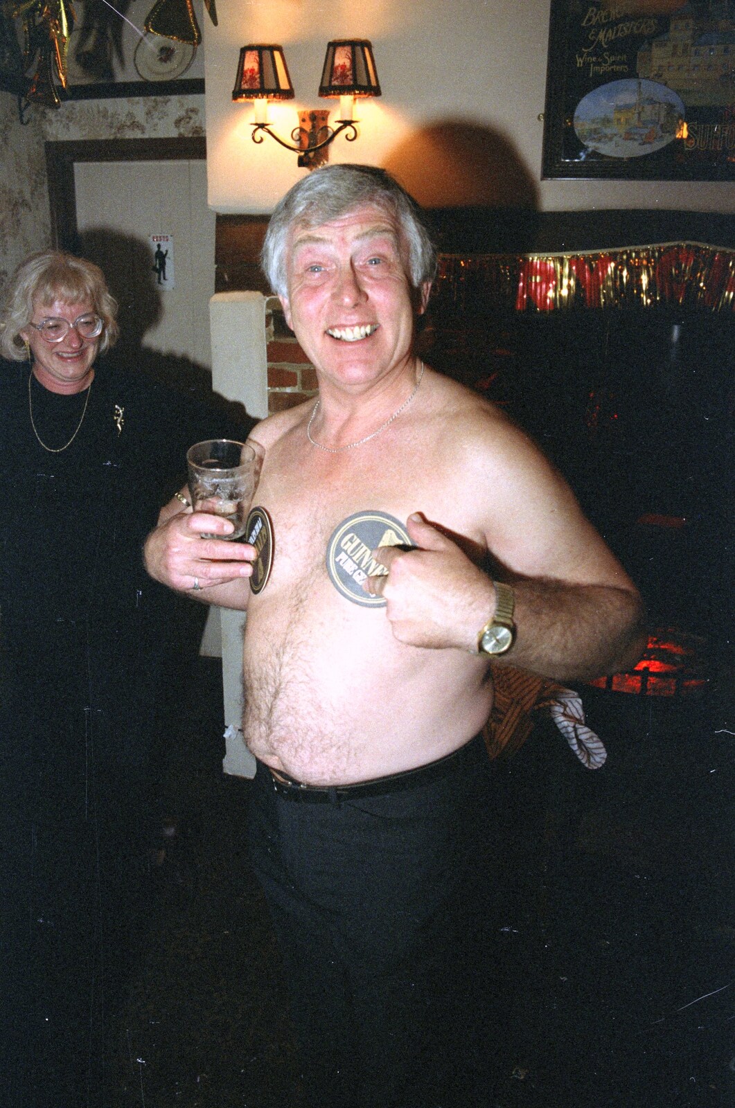 Colin covers up with Guinness bar mats from New Year's Eve at the Swan Inn, Brome, Suffolk - 31st December 1991