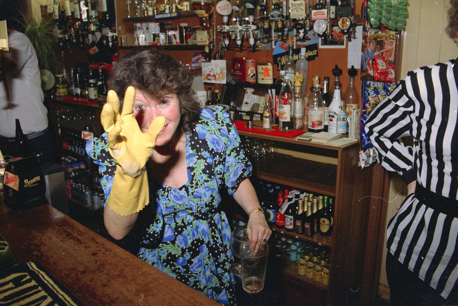 Sylvia gives it some with the rubber gloves from New Year's Eve at the Swan Inn, Brome, Suffolk - 31st December 1991