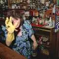 Sylvia gives it some with the rubber gloves, New Year's Eve at the Swan Inn, Brome, Suffolk - 31st December 1991