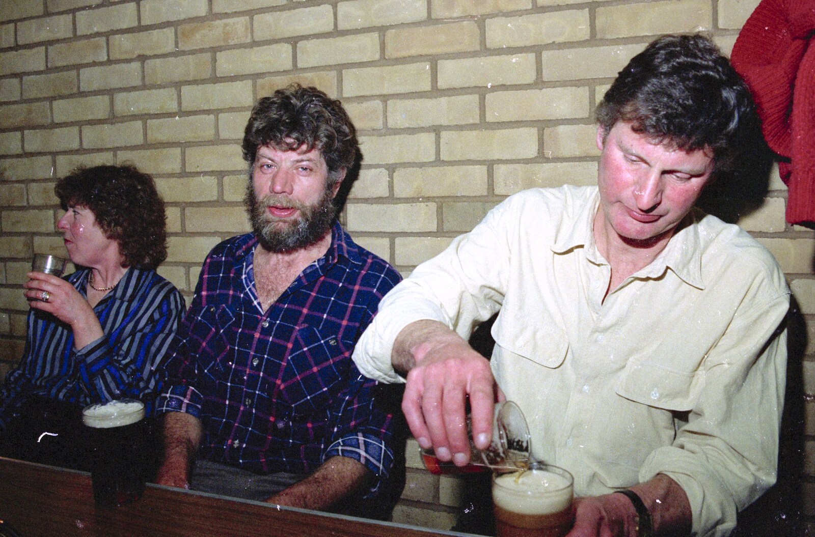 Geoff tops up his beer from A Ceilidh and a Walk Across the Common, Stuston - 26th February 1992