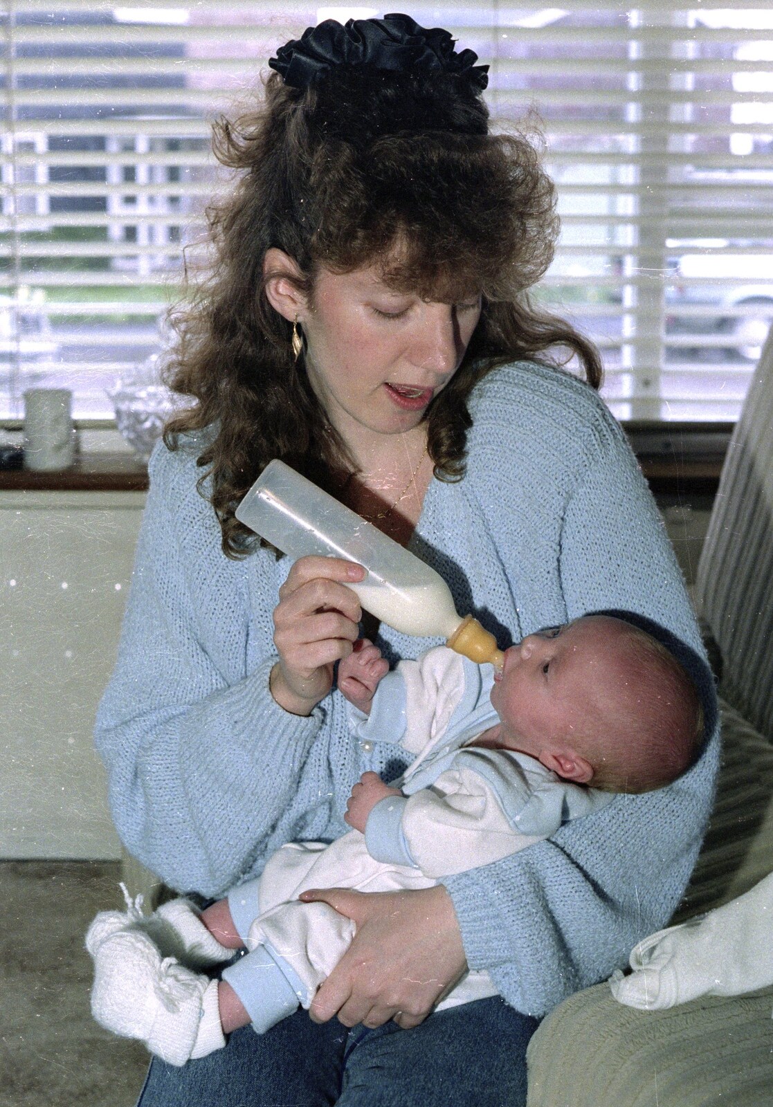 A Trip to Center Parcs, Eemhof, Netherlands - 24th March 1992: In Diss, Monique feeds her new sprog