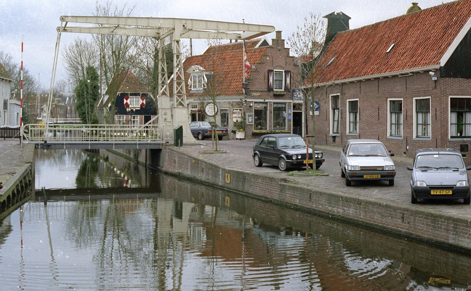 Out and About in Amsterdam, Hoorne, Vollendam and Edam, The Netherlands - 26th March 1992: A bridge over a Dutch river