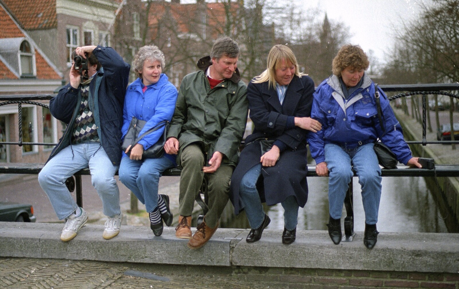 Out and About in Amsterdam, Hoorne, Vollendam and Edam, The Netherlands - 26th March 1992: Corky takes a photo as everyone perches on the railings on a bridge