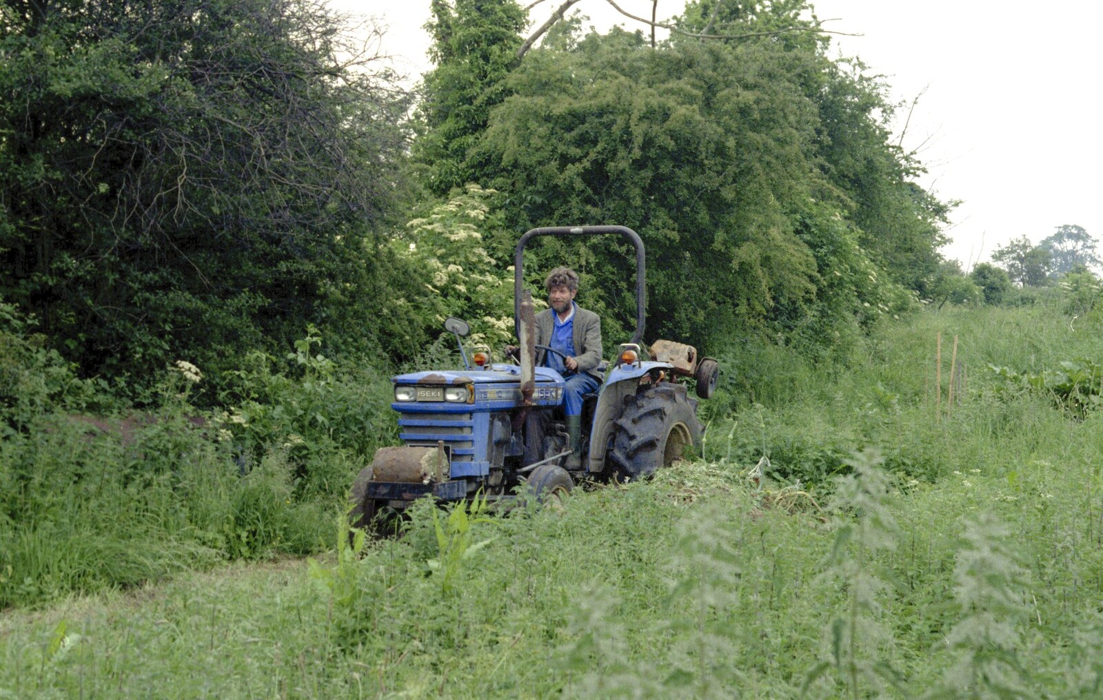 Mike Ogilsby trundles around in his tractor from The Election Caravan and a View from a Cherry Picker, Stuston, Suffolk - 9th April 1992
