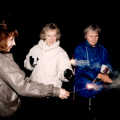 Monique, Jean and Linda wave sparklers about