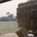 The first bale is chucked down from the trailer, Working on the Harvest, Tibenham, Norfolk - 11th August 1992
