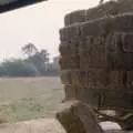 The first bale is chucked down from the trailer, Working on the Harvest, Tibenham, Norfolk - 11th August 1992