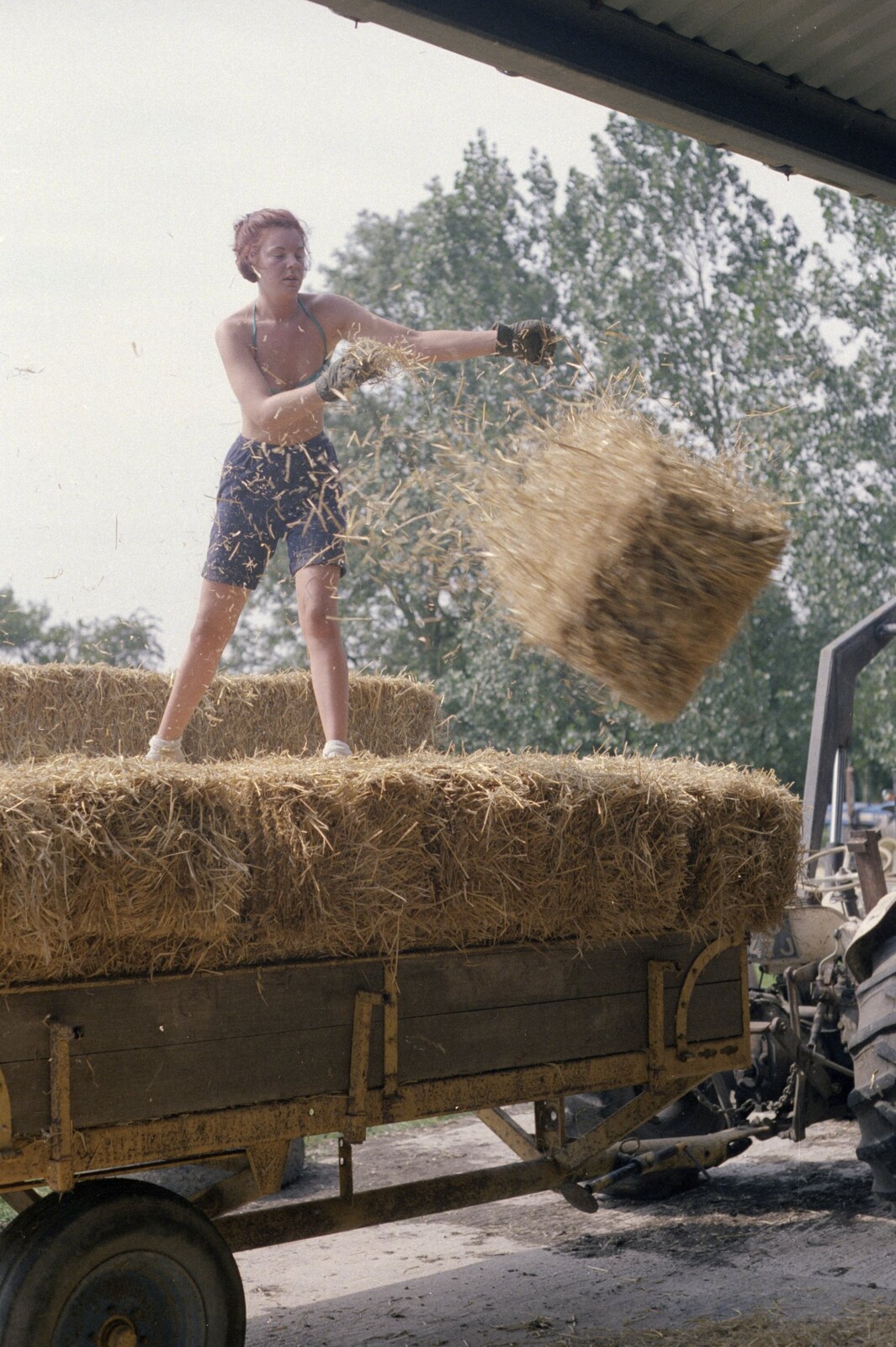 Working on the Harvest, Tibenham, Norfolk - 11th August 1992: Sarah throws a bale down