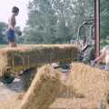 Rachel chucks bales around in the shed, Working on the Harvest, Tibenham, Norfolk - 11th August 1992