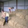 Sue and Mike stack bales, Working on the Harvest, Tibenham, Norfolk - 11th August 1992