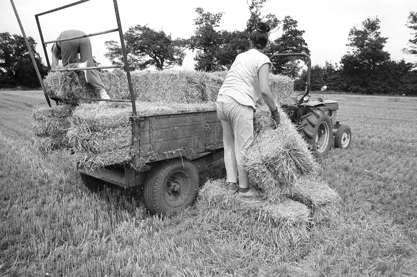 Rachel hauls a bale up, from Working on the Harvest, Tibenham, Norfolk - 11th August 1992