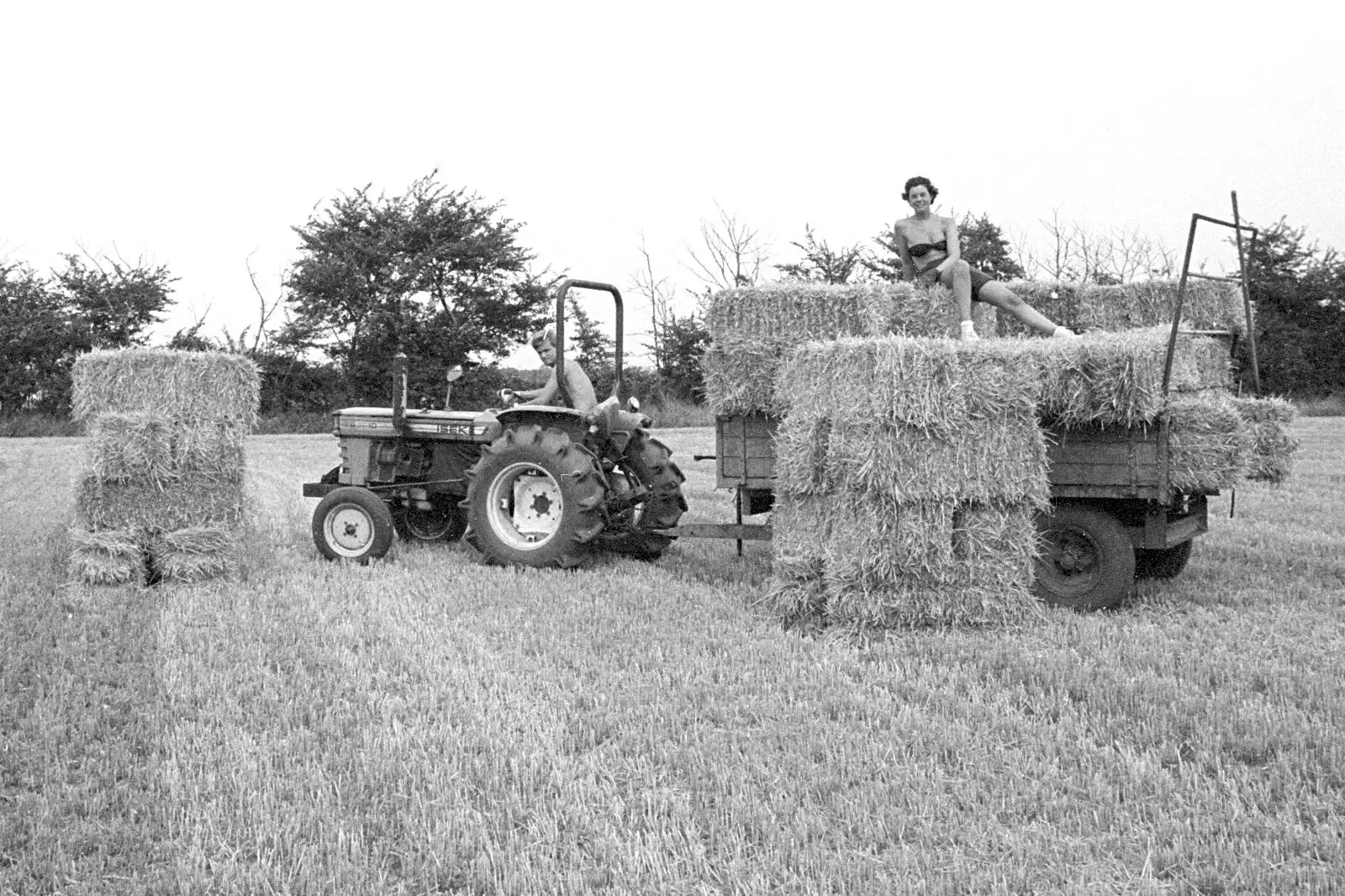 Nosher drives the tractor around the field, from Working on the Harvest, Tibenham, Norfolk - 11th August 1992