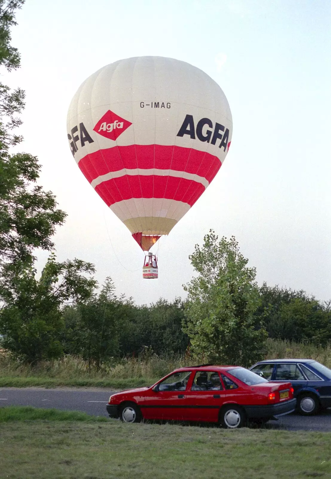 A balloon lands in the field behind Bernie , from The Eye Show and a Trip to Halifax, Suffolk and South Yorkshire - 28th August 1992