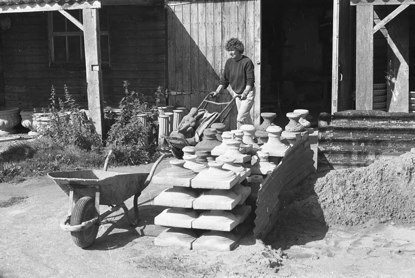 Brenda wheels some ornaments out of the shed, from A Black and White Life in Concrete, Stuston, Suffolk - 3rd September 1992