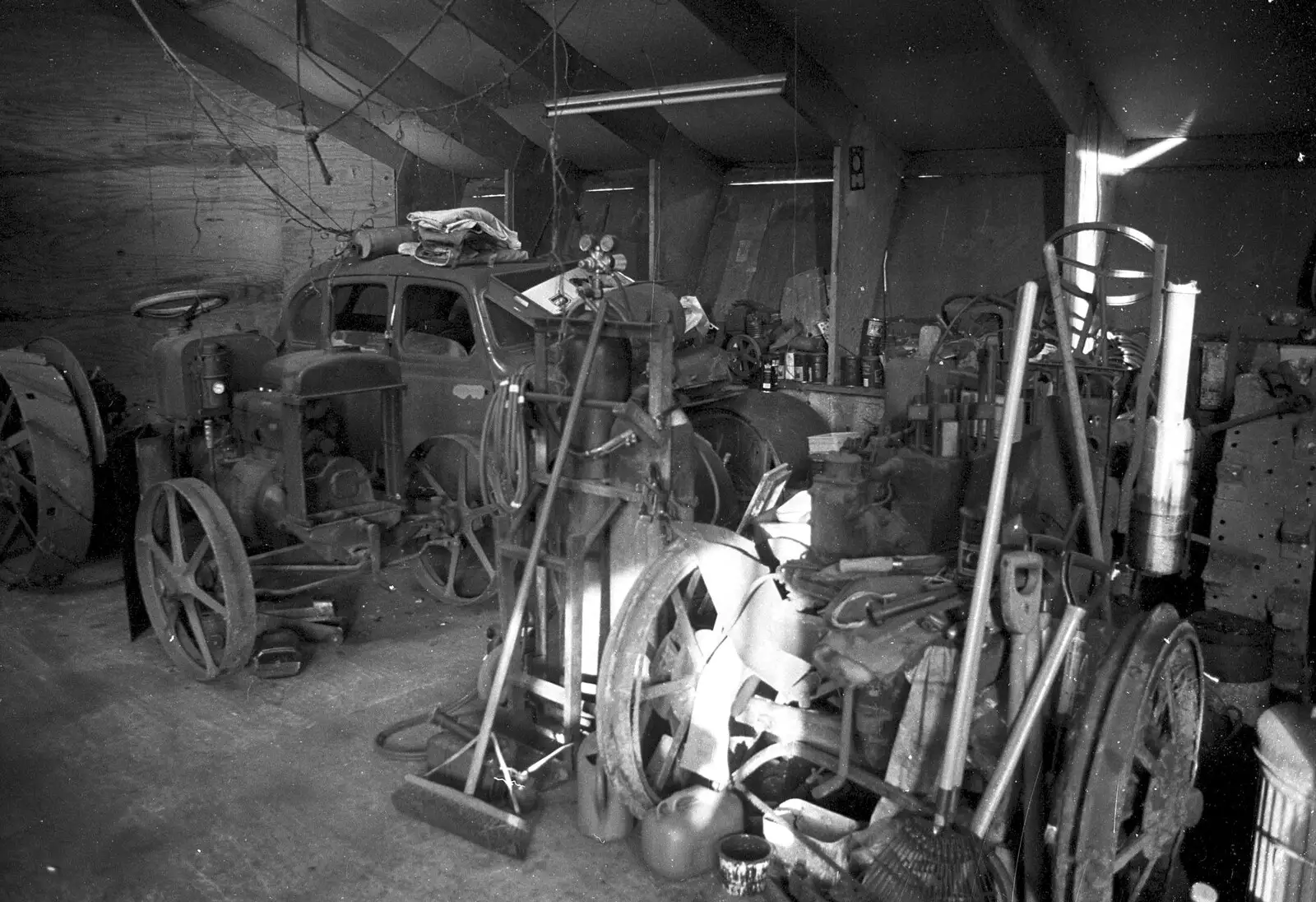 An old car and tractor in a shed, from A Black and White Life in Concrete, Stuston, Suffolk - 3rd September 1992