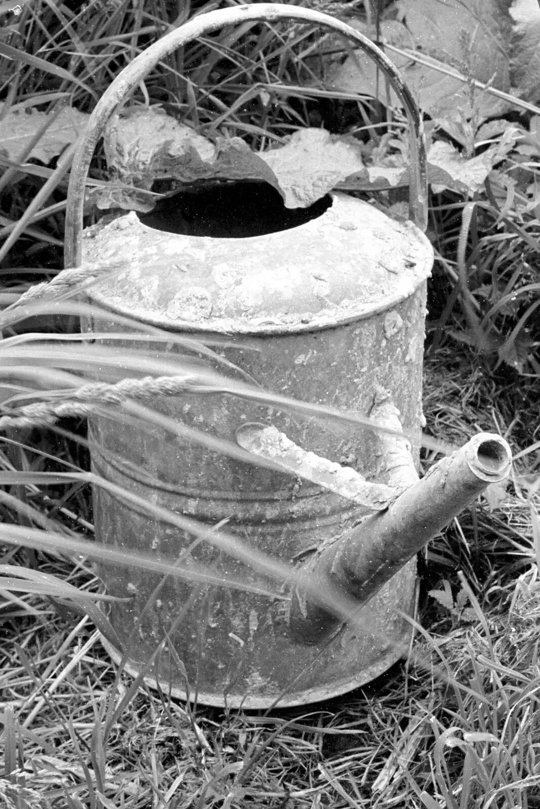 An old watering can looks like it has barnacles, from A Black and White Life in Concrete, Stuston, Suffolk - 3rd September 1992