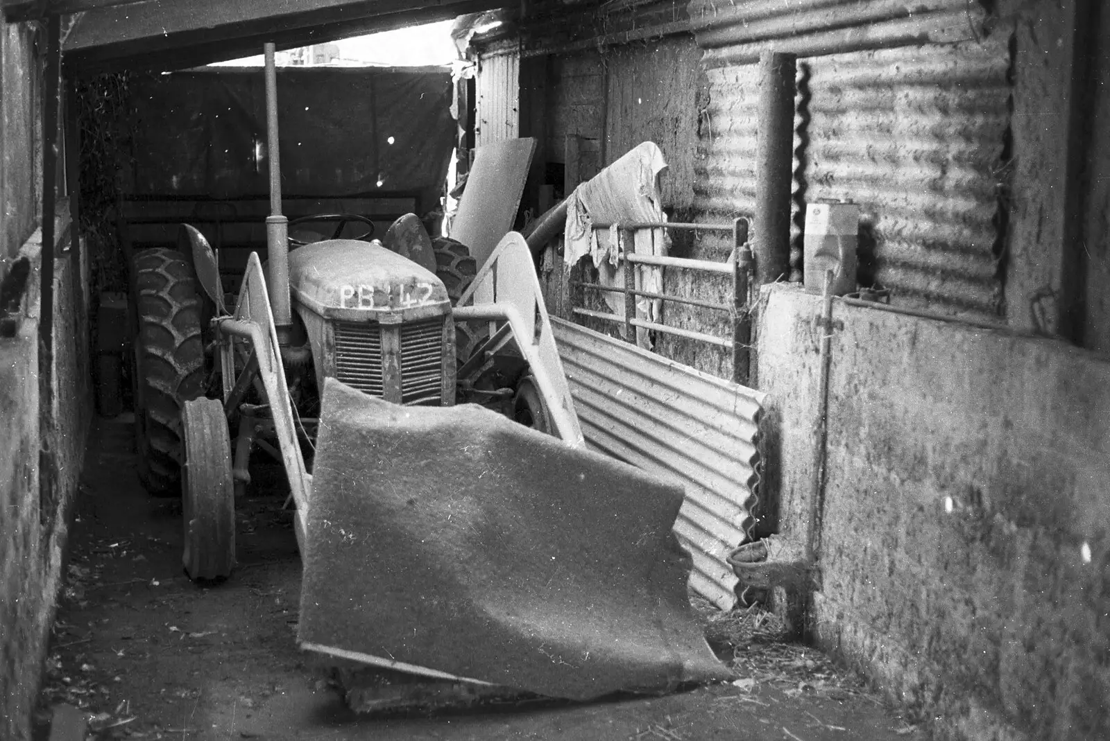 Winnie the tractor in the garage, from A Black and White Life in Concrete, Stuston, Suffolk - 3rd September 1992