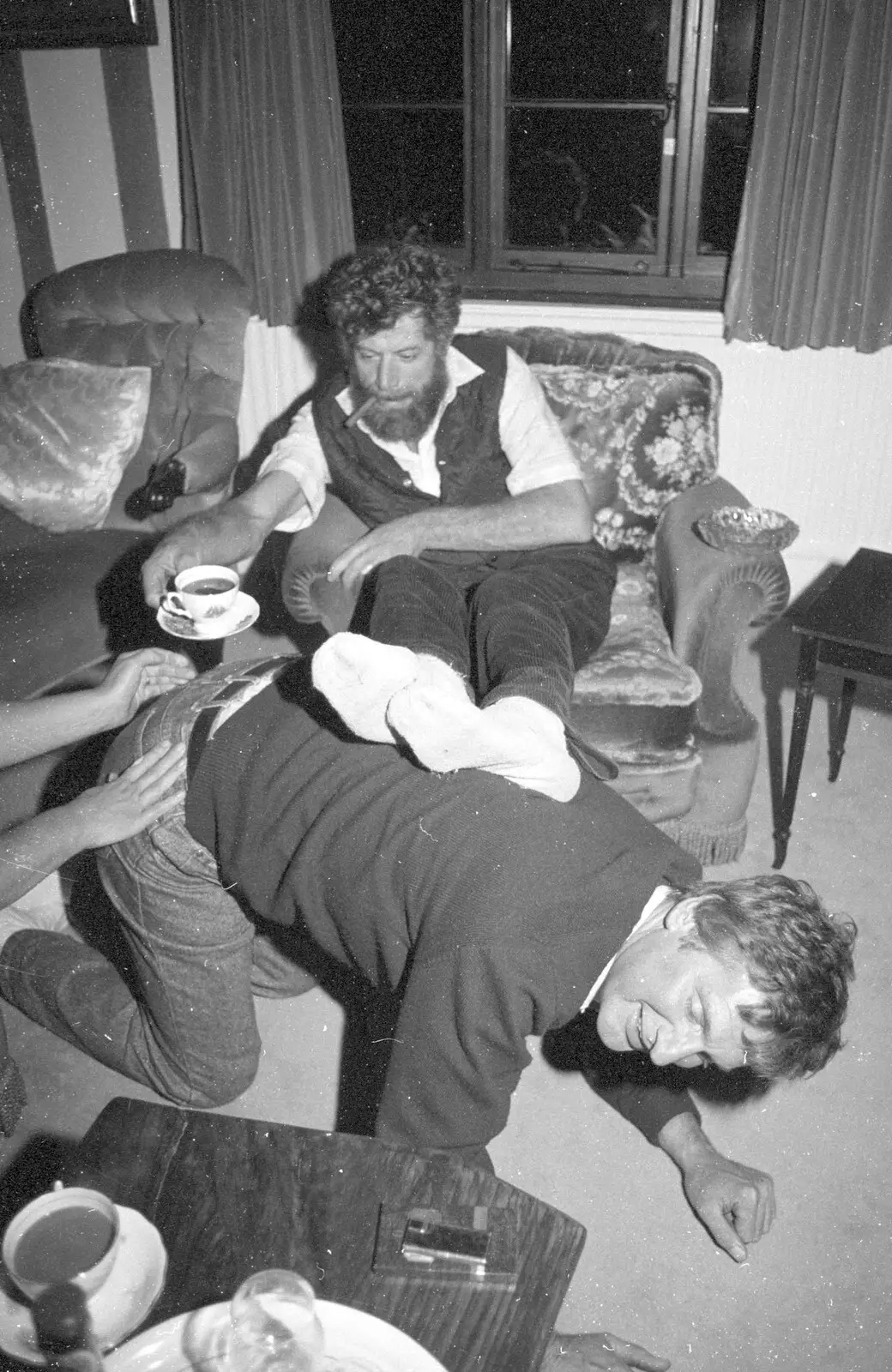 Geoff acts as a foot stool for Mike, from Cider Making in Black and White, Stuston, Suffolk - 11th October 1992