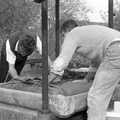 Badger and Geoff fold over the first cheese, Cider Making in Black and White, Stuston, Suffolk - 11th October 1992