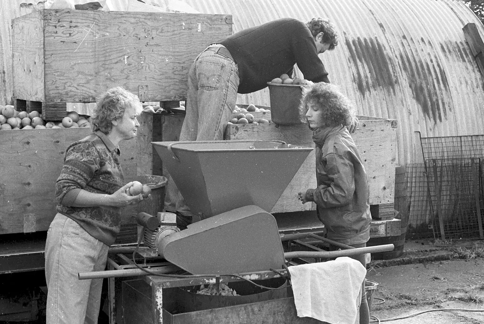 Monique looks in the hopper, from Cider Making in Black and White, Stuston, Suffolk - 11th October 1992