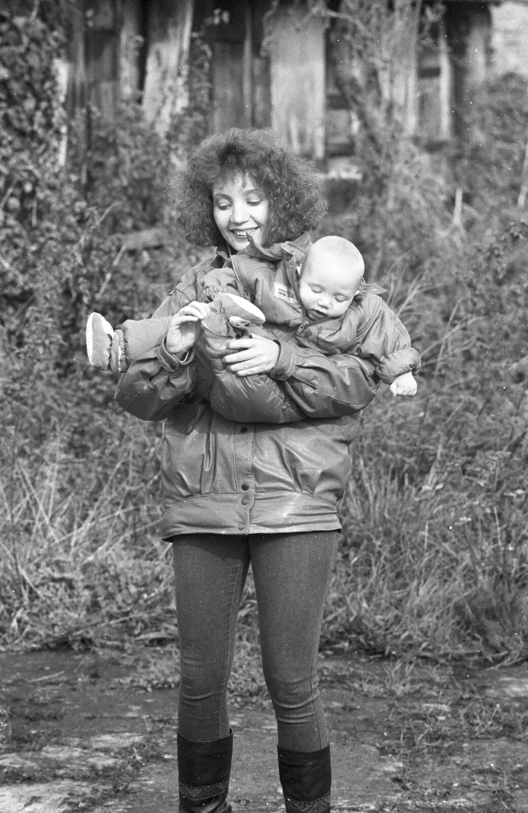 Monique scoops up the baby, from Cider Making in Black and White, Stuston, Suffolk - 11th October 1992