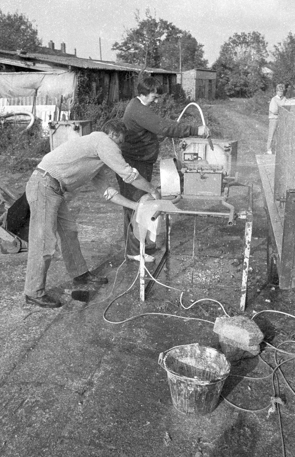 Corky cleans the pump from Cider Making in Black and White, Stuston, Suffolk - 11th October 1992