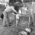 Corky cleans the pump, Cider Making in Black and White, Stuston, Suffolk - 11th October 1992