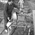 Corky cleans the chopper blades, Cider Making in Black and White, Stuston, Suffolk - 11th October 1992
