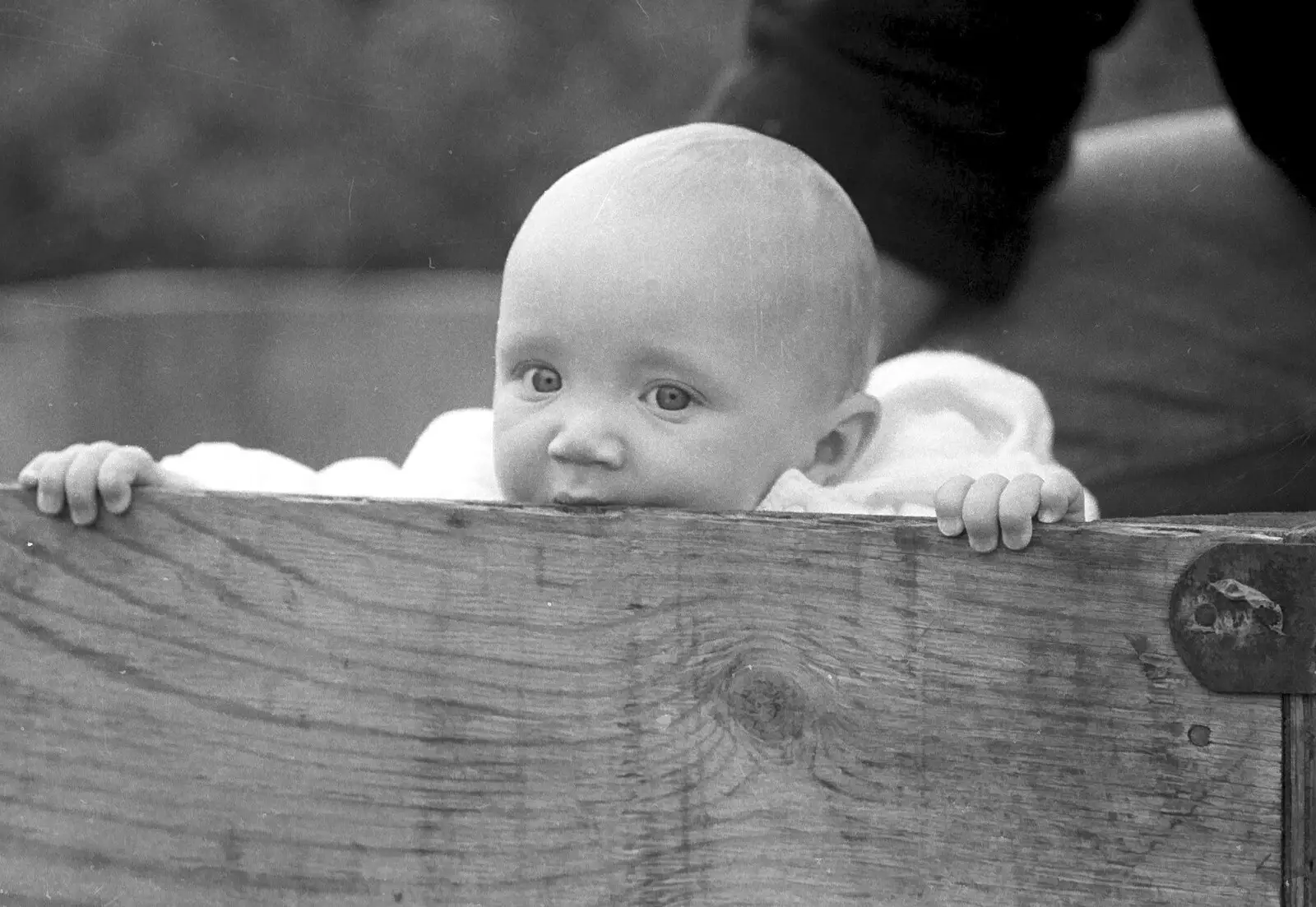 Monique's baby chews on a box, from Cider Making in Black and White, Stuston, Suffolk - 11th October 1992