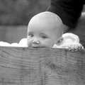 Monique's baby chews on a box, Cider Making in Black and White, Stuston, Suffolk - 11th October 1992