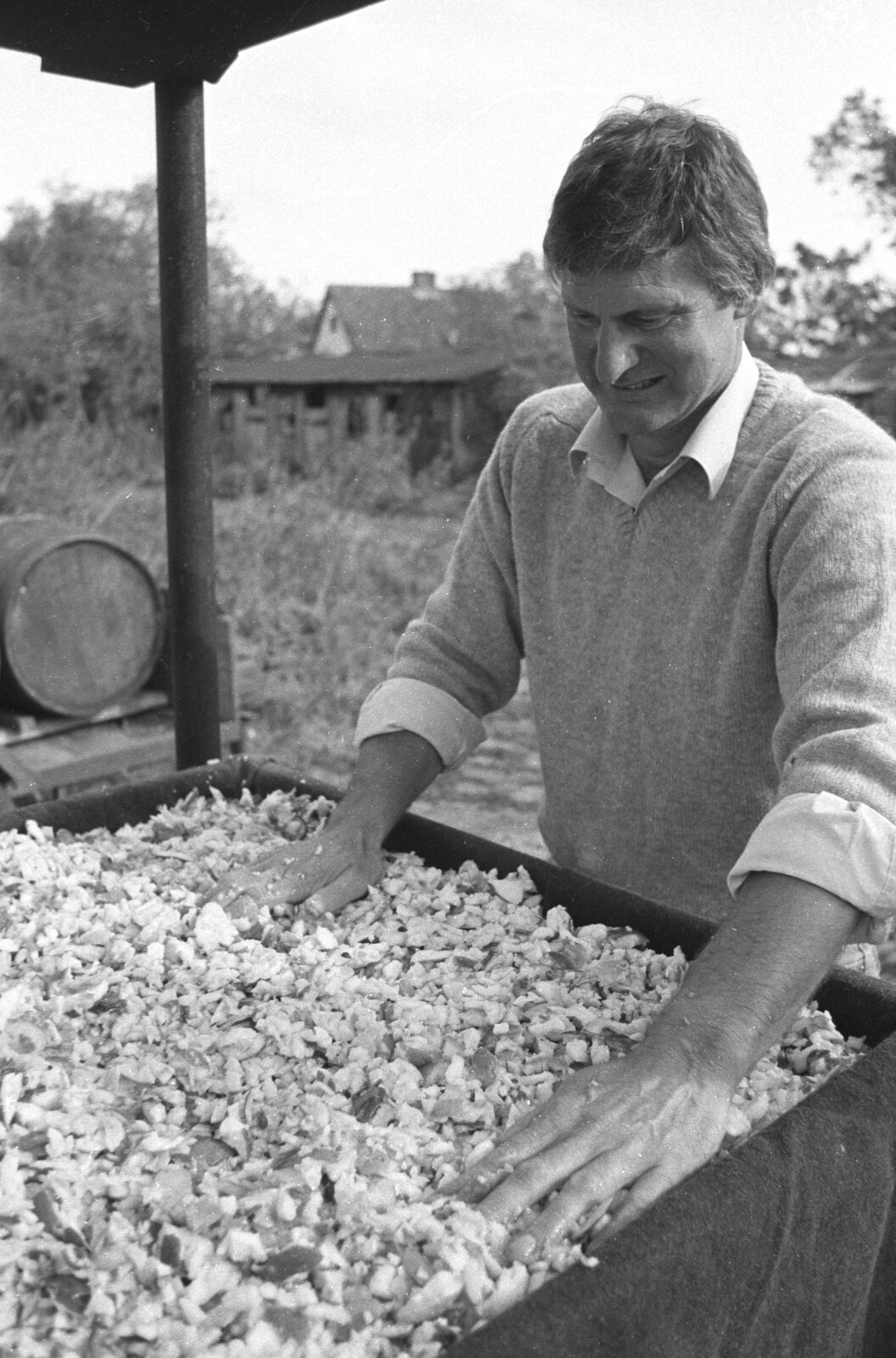 Geoff spreads apple around from Cider Making in Black and White, Stuston, Suffolk - 11th October 1992