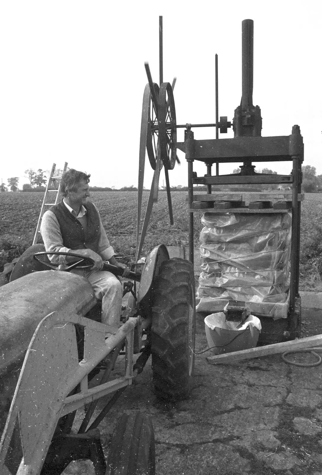 Winnie is strapped up to the press, from Cider Making in Black and White, Stuston, Suffolk - 11th October 1992