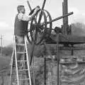 Geoff straps up the drive belt, Cider Making in Black and White, Stuston, Suffolk - 11th October 1992