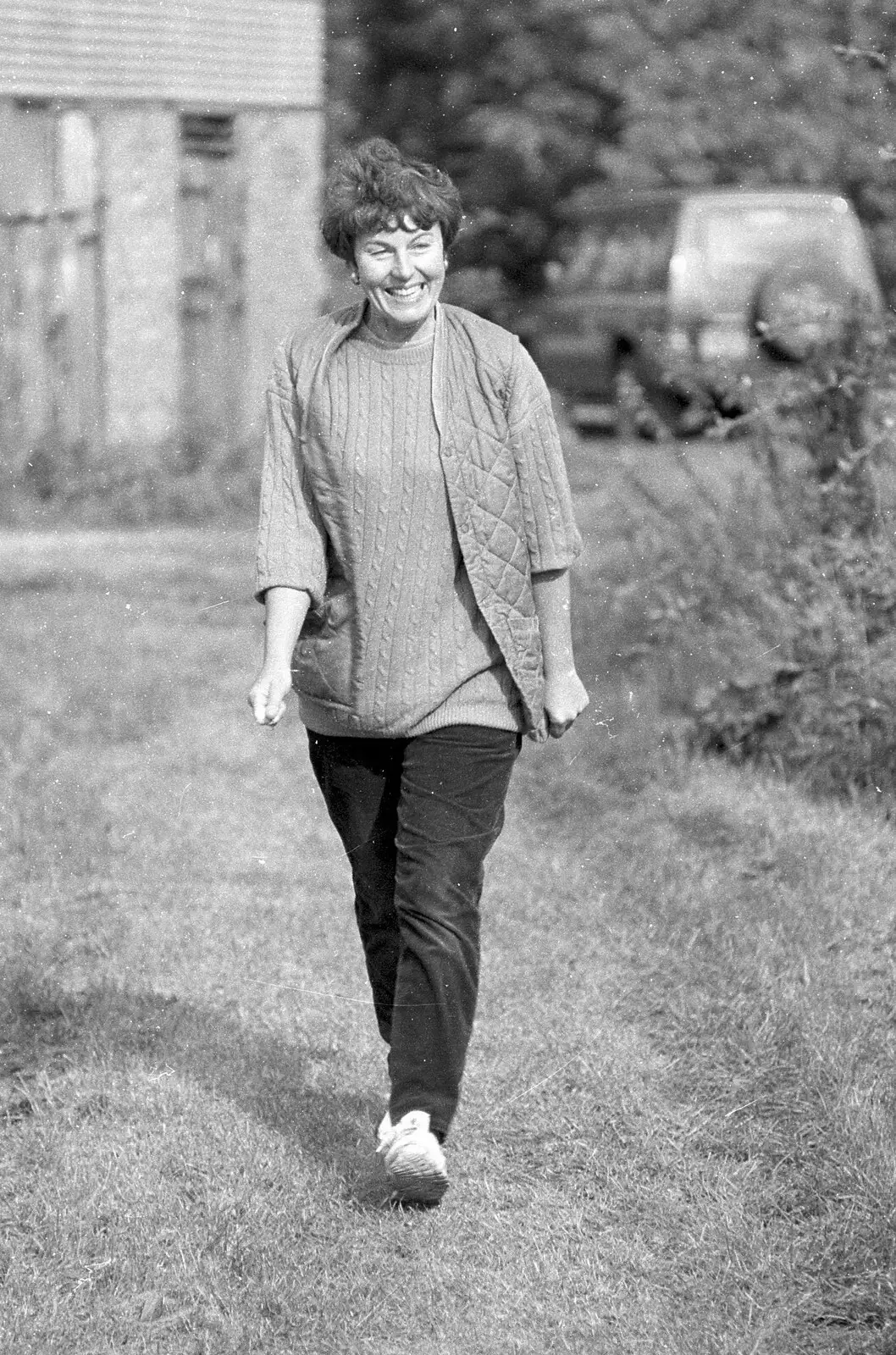 Sue 'Badger' walks back from the bog, from Cider Making in Black and White, Stuston, Suffolk - 11th October 1992