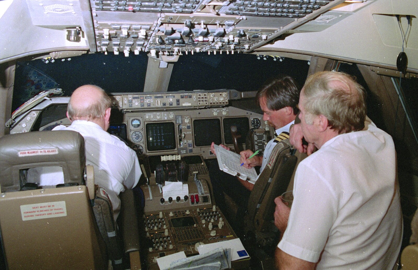 The boys keep doing their paperwork from A 747 Cockpit, Honolulu and Pearl Harbor, O'ahu, Hawai'i, United States - 20th November 1992