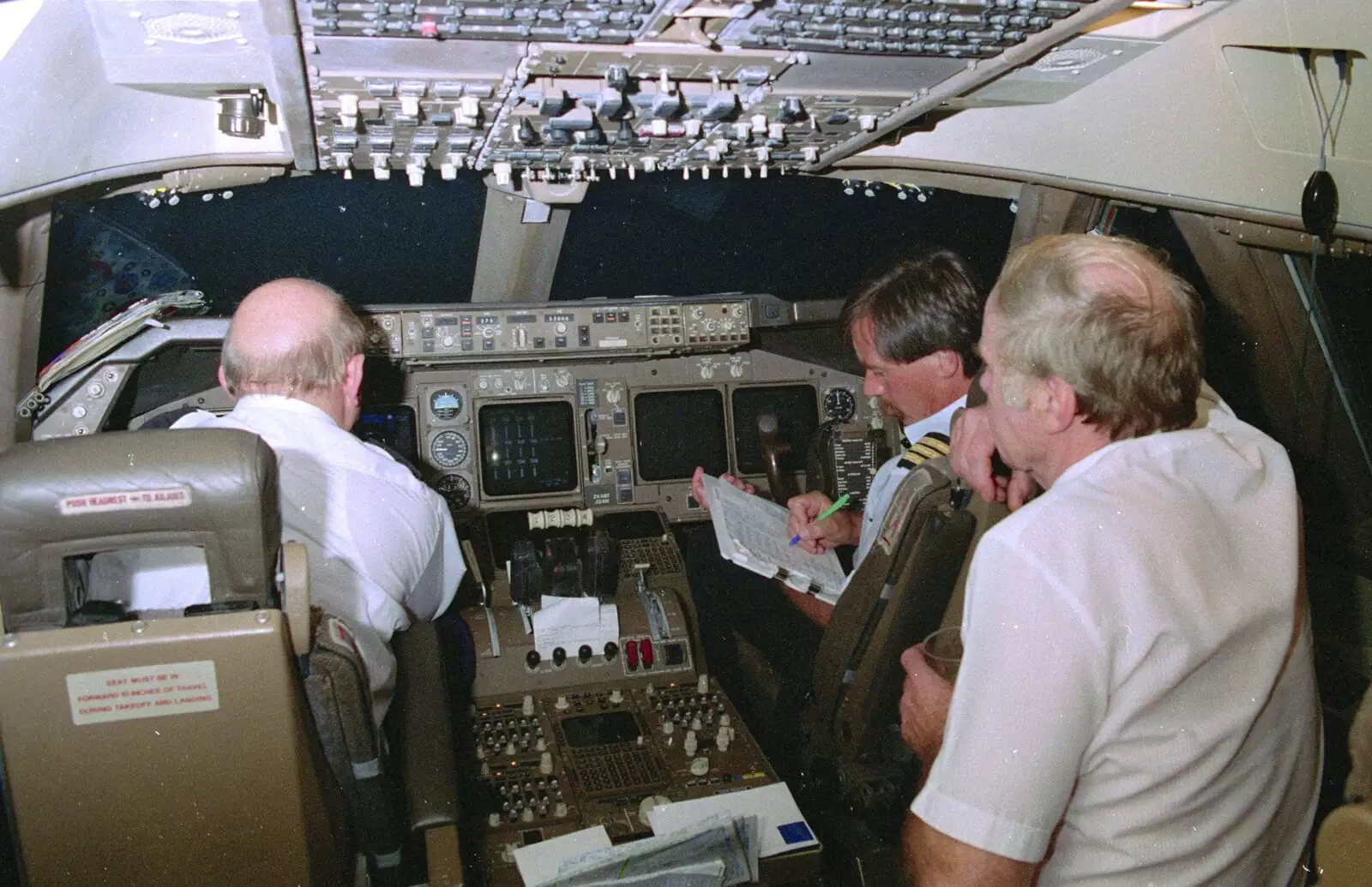 The boys keep doing their paperwork, from A 747 Cockpit, Honolulu and Pearl Harbor, O'ahu, Hawai'i, United States - 20th November 1992