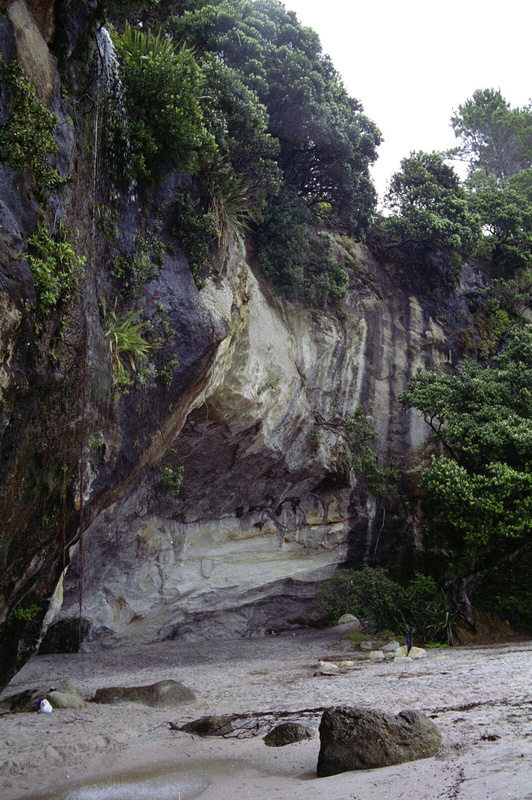 A mini waterfall tumbles over the cliff from Ferry Landing, Whitianga, New Zealand - 23rd November 1992