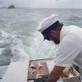 The skipper chops some fish up, Ferry Landing, Whitianga, New Zealand - 23rd November 1992