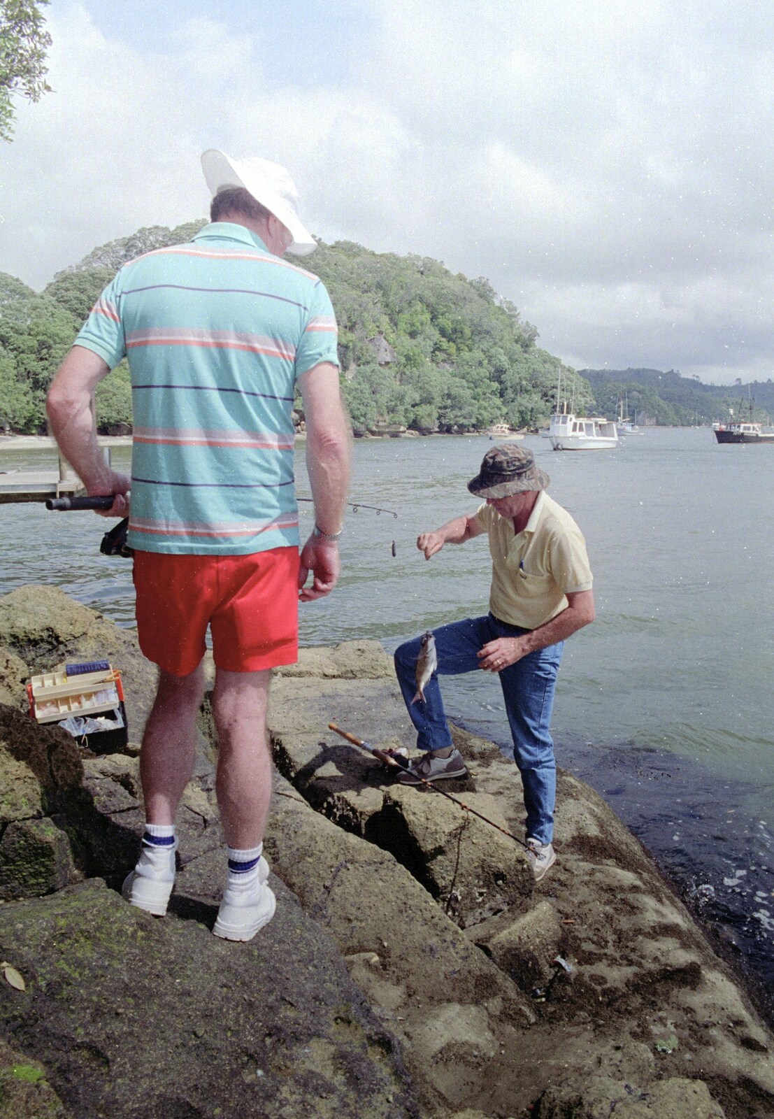 Clive climbs the rocks with a fish in tow from Ferry Landing, Whitianga, New Zealand - 23rd November 1992