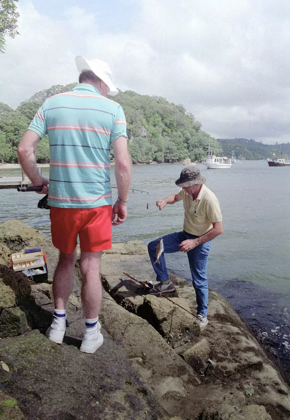 Clive climbs the rocks with a fish in tow, from Ferry Landing, Whitianga, New Zealand - 23rd November 1992