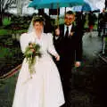 Anna heads into the church as her dad holds the umbrella, Anna and Chris's Wedding, Southampton - December 1992