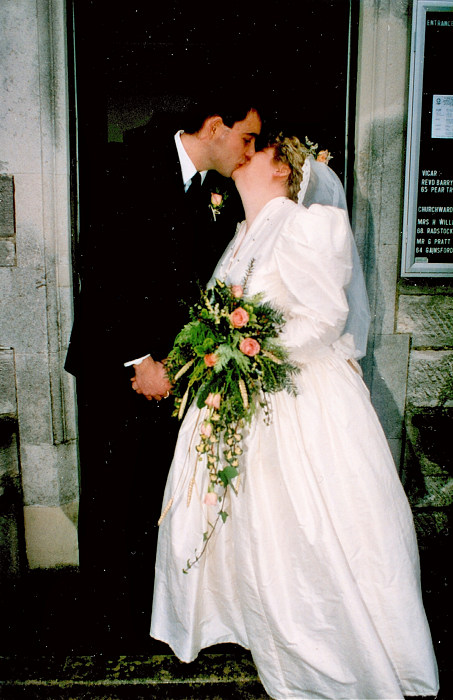 A kiss on the steps of the church from Anna and Chris's Wedding, Southampton - December 1992