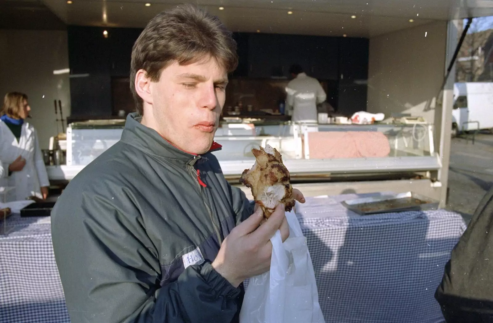 Pete eats some sort of chicken-based snack, from Clays Does Bruges, Belgium - 19th December 1992