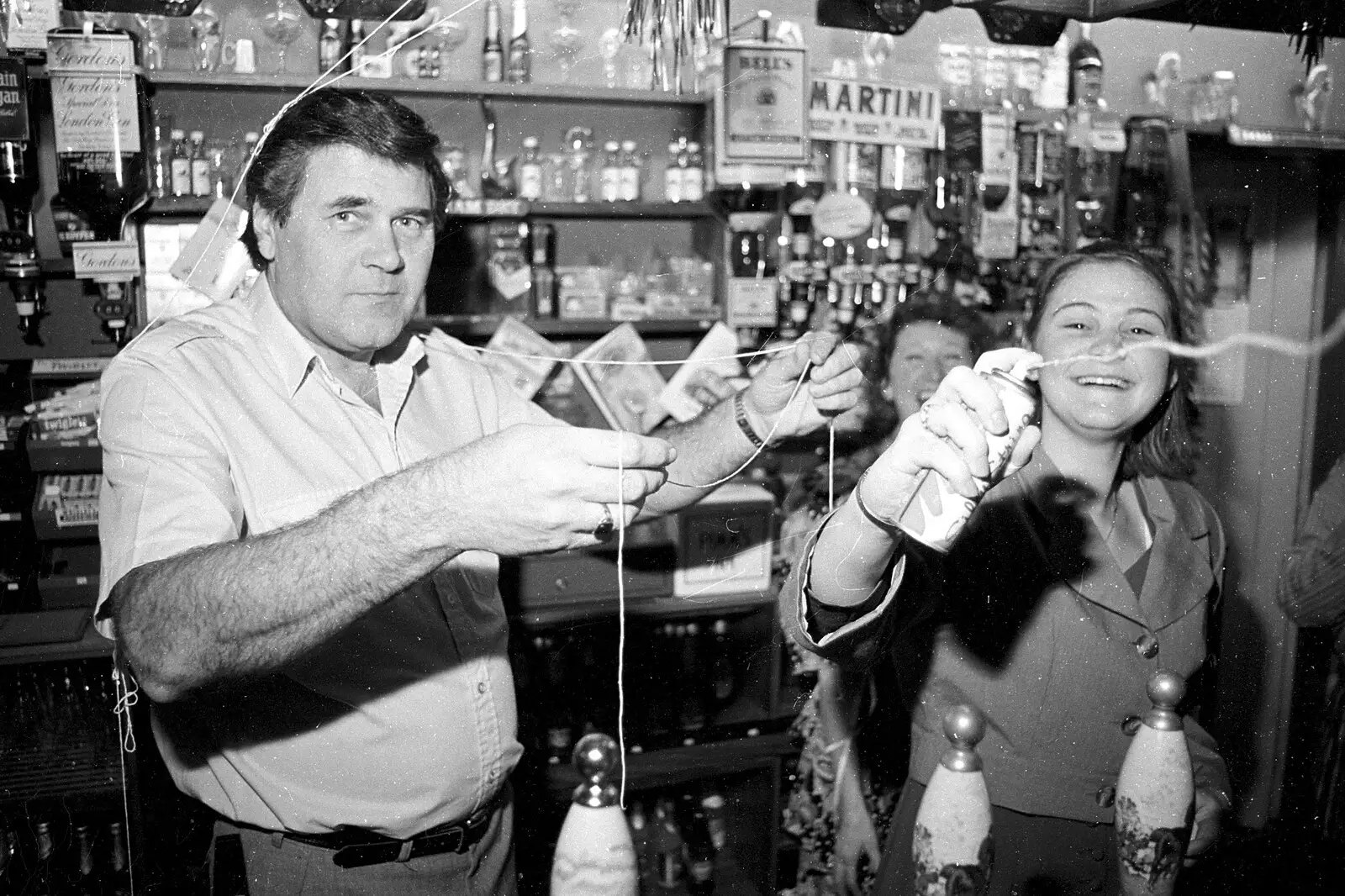 Alan looks up as Claire squirts silly string, from New Year's Eve at the Swan Inn, Brome, Suffolk - 31st December 1992