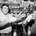 Alan looks up as Claire squirts silly string, New Year's Eve at the Swan Inn, Brome, Suffolk - 31st December 1992